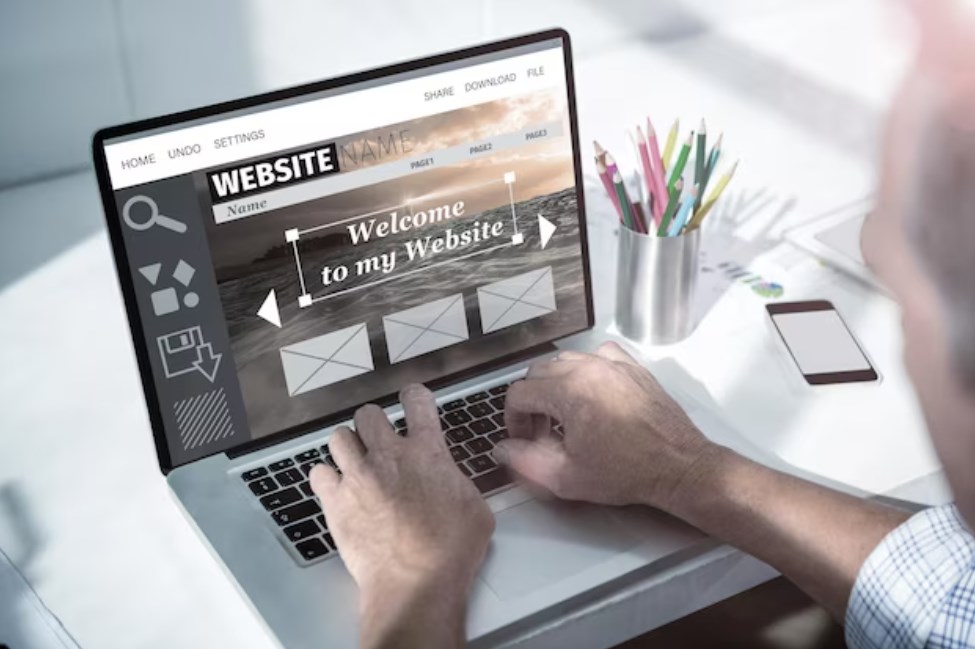 a man using a laptop to create a website
